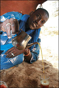 A Tuareg Man pours himself a fresh cup of tea