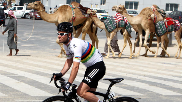 Mark Cavendish rides Tour of Qatar with camels in background