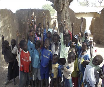 Children in Pampaida, northern Nigeria, respond top the question: "Who wants to go to school?"