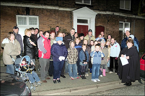 People standing in a street. 470