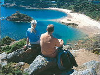 Tourists looking over Portelet Bay