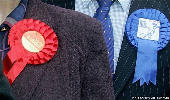 Candidates wearing Labour and Conservative rosettes