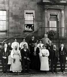 The Staff of Erddig in 1912, each holding their "Badge of Office"
