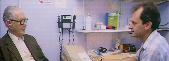 A G.P. interviewing a patient.