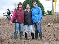 Visitors to the Dorset County Show making their way through the mud.