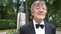 Stephen Fry with a statue of Wagner as he attends the Bayreuth Festival