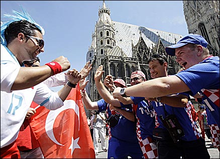 Turkey and Croatia fans engage in some banter in Vienna city centre