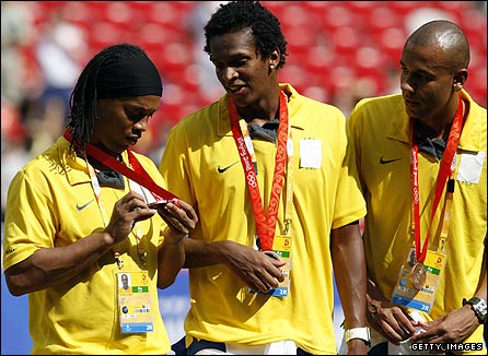 Ronaldinho inspects his bronze medal