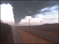 A deserted M1 covered in smoke.