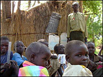 Pupils taking a class under a tree in Rumbek, southern Sudan