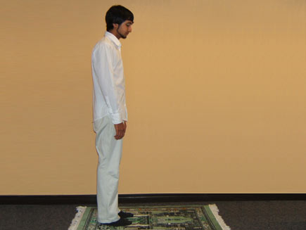 A man stands with his hands to his sides