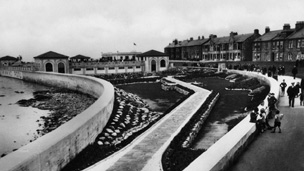 Black and white view of gardens and 1930s swimming pool building at Troon Esplanade.