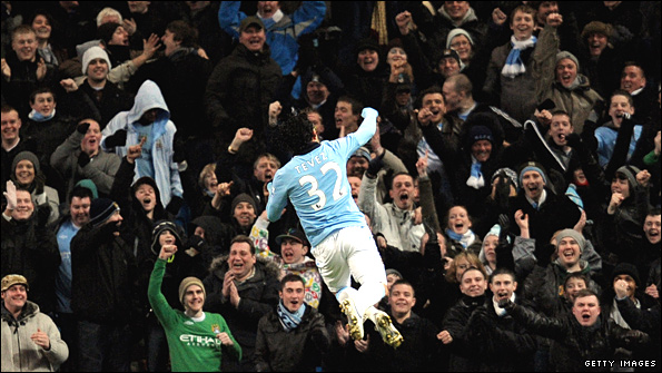Carlos Tevez runs to City fans 