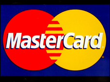 Mastercard and Visa logos on a window