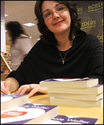 Annie signing her book, Married to Albert
