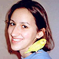 Julia with one of her budgies sitting on her shoulder