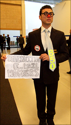 Protestor_suggesting_oil_money_funded_the_hack