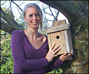 Producer, Jess Dunbar proudly shows off her carpentry efforts.