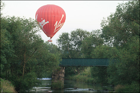 Virgin hot air balloon passing over Sunnybrow