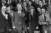 photograph of Clement Attlee celebrating Labour Party election victory - with WV Edwards (left) and Mrs Attlee, Stepney, London, 26 July 1945