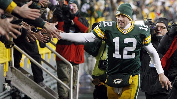 Green Bay quarterback Aaron Rodgers celebrates with fans after his side's win over Chicago on Sunday