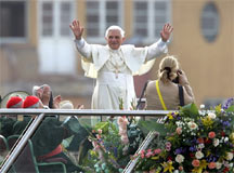 Pope Benedict XVI on a podium addressing crowds