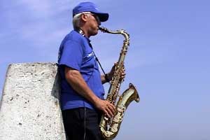 Peter plays his saxophone on the highest point in Cornwall.
