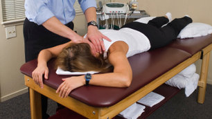 A patient being stretched by a physiotherapist