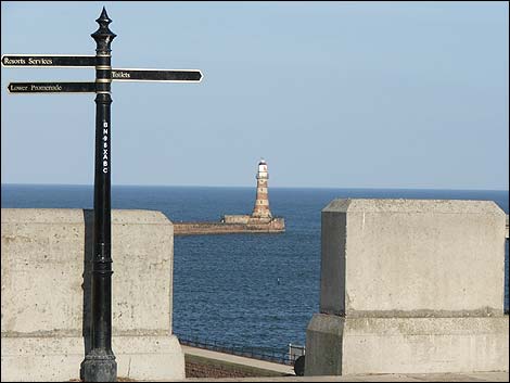 Sign with directions and Roker Terrace Lighthouse
