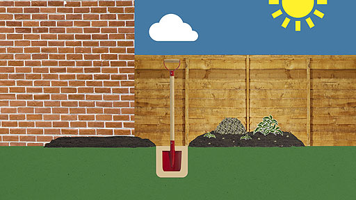 A half-dug plot, with piles of weeds and stones