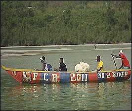 Fishermen display their allegiance to Spanish football giants Barcelona on the side of their boat at No. 2 River Beach, Freetown