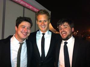 Dan Walker with two band members of Mumford & Sons
