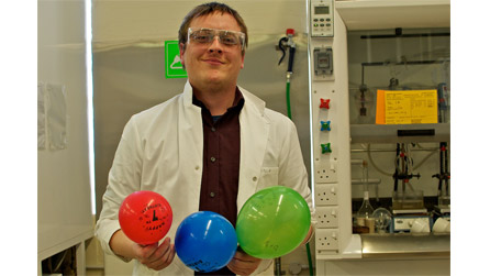 Dr Tom Davies with gas filled balloons Dr Tom Davies with gas filled balloons