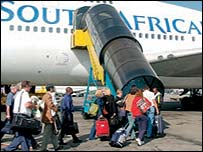 South African airliner being boarded on the tarmac