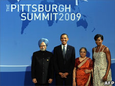 US President Barack Obama and First Lady Michelle Obama welcome Indian Prime Minister Manmohan Singh and his wife Gursharan Kaur to the G20 dinner at the Phipps Conservatory on 24 September 2009 in Pittsburgh, Pennsylvania
