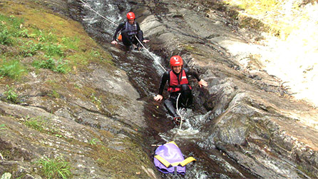 People sliding down a gorge by CCW