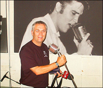 Tony Gillham 'singing with Elvis'.