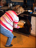 Jenny removes a marangue base from oven
