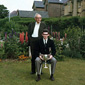 A young Basil with his father Harry. Taken in their back garden, Basil is holding up the Irish School Champions cup, and wearing his Methody school uniform