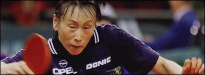 A table tennis champion in action.