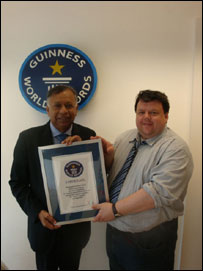 Dr.Jayalath Jayawardena receiving Guiness book of Record from Editor in Chief Craig Glenday.