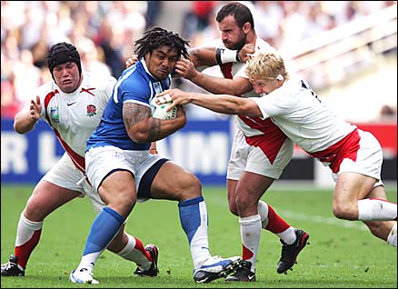 Alfie Vaeluega of Samoa holds off the English defence