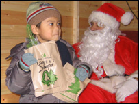 A pupil from St Wilfrid's School with Santa