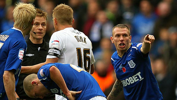 Cardiff's Craig Bellamy tries to get the referee's attention