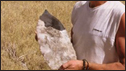 Professor David Thomas with giant stone axe head, Lake Makgadikgadi