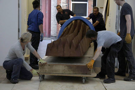 A David Nash sculpture being manoeuvred into position in the gallery. Photo: Martin Barlow