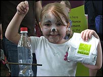 A girl with a bird feeder