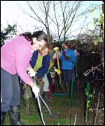 Volunteers working on Saintbridge Pond