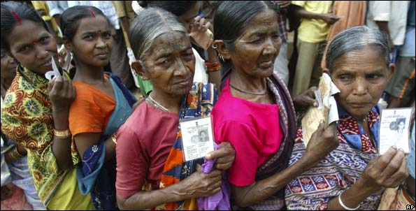 Villagers presently living in relief camps hold their voter