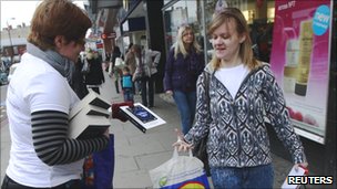 Volunteer hands out free books for World Book Night